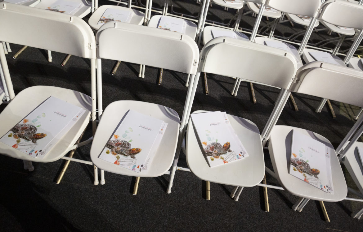Folding chairs with graduation program booklet