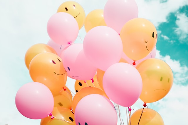 Balloons with smiles and frowns